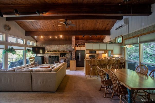 Dining room, Fireplace, Interior, Kitchen, Living room, Pendant Lights, Stainless Steel Appliances, Stone Walls, Wooden Beams, Wooden Ceilings