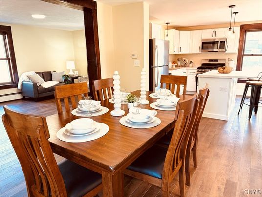Dining room, Interior, Kitchen, Pendant Lights, Recessed Lighting, Stainless Steel Appliances, Wood Texture Flooring