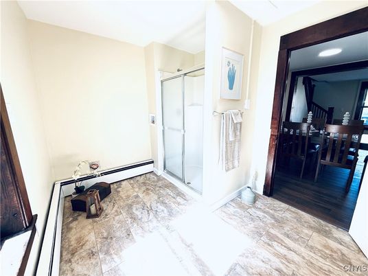 Bathroom, Dining room, Glass Shower, Interior, Recessed Lighting, Wood Texture Flooring