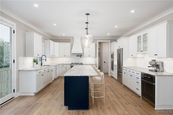 Interior, Kitchen, Marble Walls, Pendant Lights, Recessed Lighting, Stainless Steel Appliances, Wood Texture Flooring