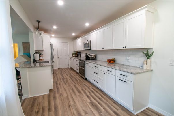 Interior, Kitchen, Pendant Lights, Recessed Lighting, Stainless Steel Appliances, Wood Texture Flooring