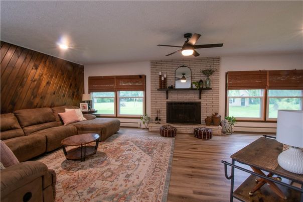 Fireplace, Interior, Living room, Recessed Lighting, Stone Walls, Wood Texture Flooring