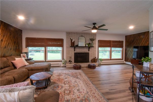 Fireplace, Interior, Living room, Recessed Lighting, Stone Walls, Wood Texture Flooring