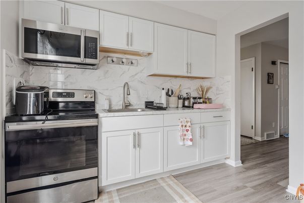 Interior, Kitchen, Marble Walls, Stainless Steel Appliances, Wood Texture Flooring