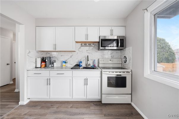 Interior, Kitchen, Marble Walls, Stainless Steel Appliances, Wood Texture Flooring