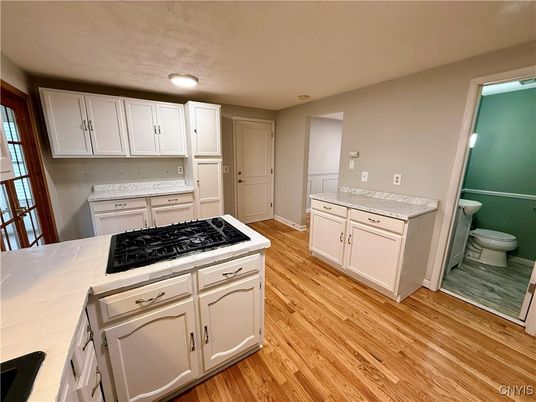 Interior, Kitchen, Tile Countertops, Wood Texture Flooring