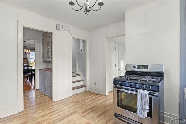 Chandelier, Dining room, Interior, Kitchen, Stainless Steel Appliances, Wood Texture Flooring