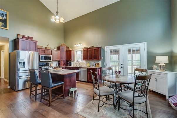 Chandelier, Dining room, Interior, Kitchen, Pendant Lights, Stainless Steel Appliances, Wood Texture Flooring