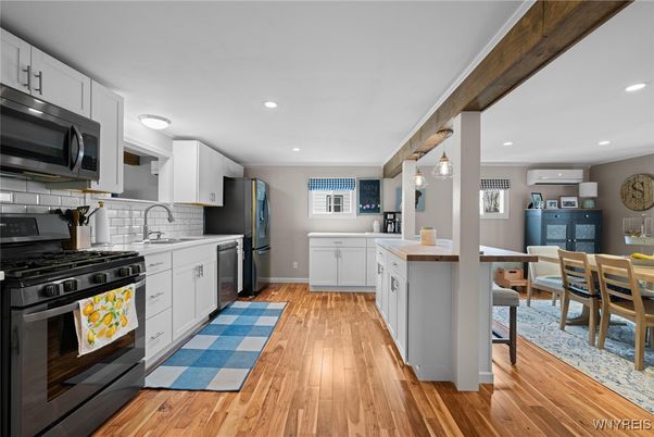 Dining room, Interior, Kitchen, Pendant Lights, Recessed Lighting, Stainless Steel Appliances, Wood Texture Flooring