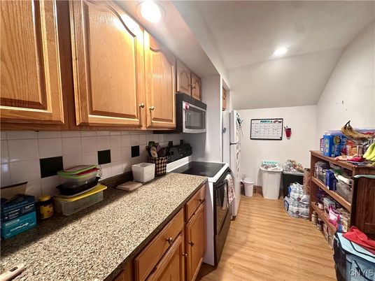Interior, Kitchen, Recessed Lighting, Washer, Wood Texture Flooring