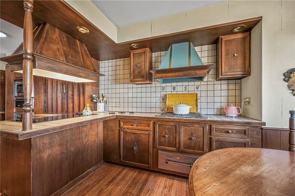 Interior, Kitchen, Recessed Lighting, Tile Countertops, Wood Texture Flooring