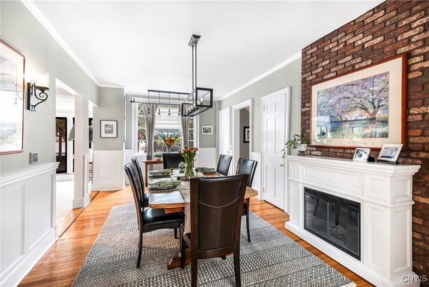 Dining room, Fireplace, Interior, Pendant Lights, Stone Walls, Wood Texture Flooring
