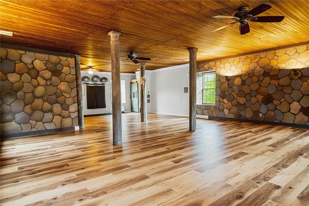Empty room, Fireplace, Interior, Stone Walls, Wooden Ceilings, Wood Texture Flooring
