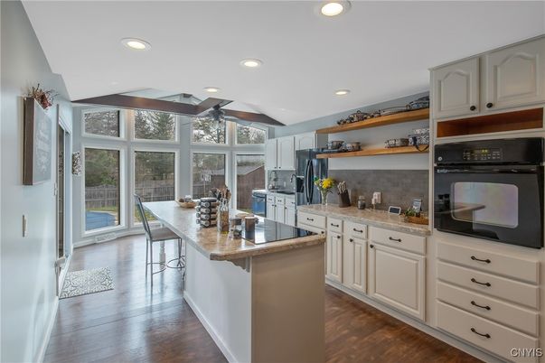 Dining room, Interior, Kitchen, Recessed Lighting, Stainless Steel Appliances, Wood Texture Flooring