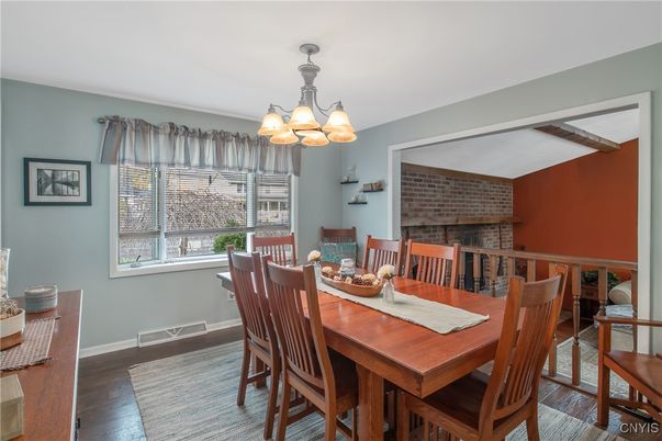 Chandelier, Dining room, Fireplace, Interior, Stone Walls, Wood Texture Flooring