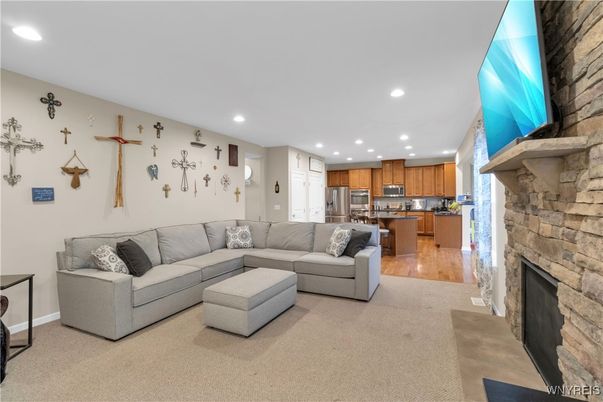 Fireplace, Interior, Kitchen, Living room, Recessed Lighting, Stainless Steel Appliances, Stone Walls, Wood Texture Flooring