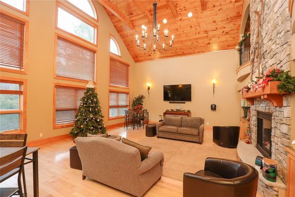 Chandelier, Dining room, Fireplace, Interior, Living room, Recessed Lighting, Stone Walls, Wooden Beams, Wooden Ceilings, Wood Texture Flooring