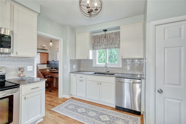 Interior, Kitchen, Pendant Lights, Stainless Steel Appliances, Tile Countertops, Wood Texture Flooring