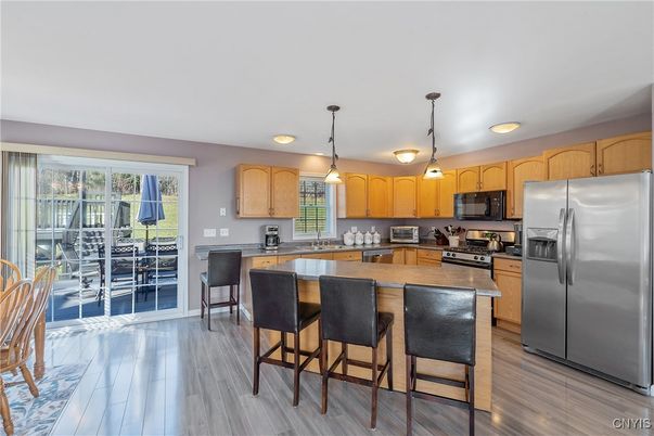 Dining room, Interior, Kitchen, Pendant Lights, Stainless Steel Appliances, Wood Texture Flooring