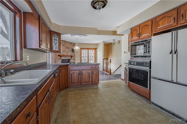 Fireplace, Interior, Kitchen, Pendant Lights, Stone Walls
