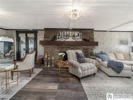 Chandelier, Fireplace, Interior, Living room, Stone Walls, Wood Texture Flooring