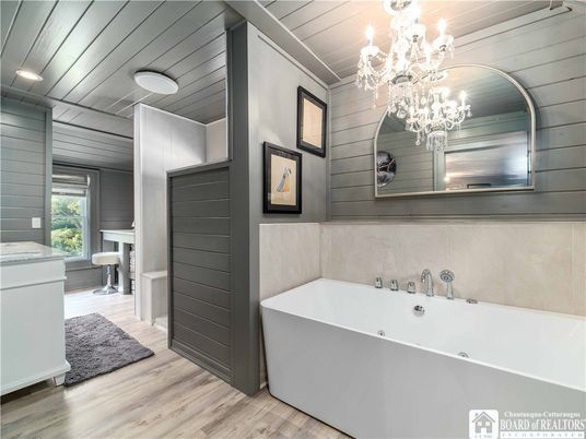 Bathroom, Chandelier, Free Standing Baths, Interior, Wood Texture Flooring
