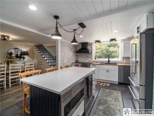 Dining room, Interior, Kitchen, Pendant Lights, Recessed Lighting, Stainless Steel Appliances, Stone Walls, Wood Texture Flooring