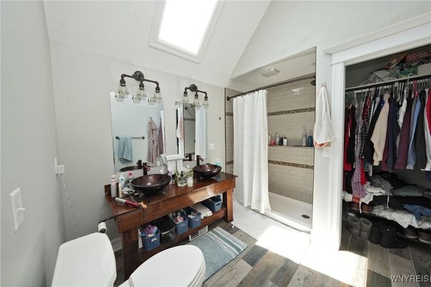 Bathroom, Dual Sink Vanities, Glass Shower, Interior, Walk-in Closets, Wood Texture Flooring