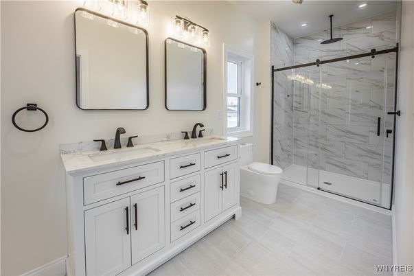 Bathroom, Dual Sink Vanities, Glass Shower, Interior, Marble Walls, Recessed Lighting