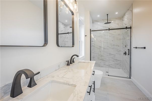 Bathroom, Dual Sink Vanities, Glass Shower, Interior, Marble Walls, Recessed Lighting