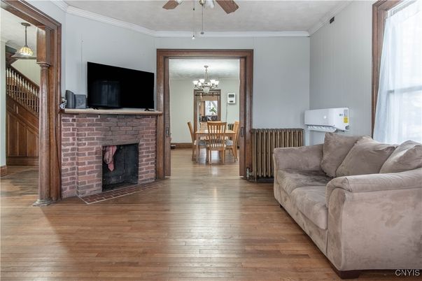 Chandelier, Dining room, Fireplace, Interior, Living room, Pendant Lights, Wood Texture Flooring