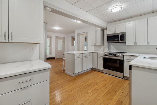 Interior, Kitchen, Recessed Lighting, Stainless Steel Appliances, Wood Texture Flooring