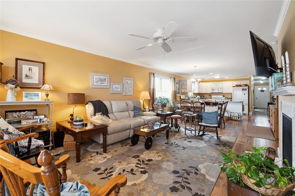 Dining room, Fireplace, Interior, Kitchen, Living room, Pendant Lights, Stainless Steel Appliances, Wood Texture Flooring