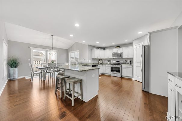 Dining room, Interior, Kitchen, Pendant Lights, Recessed Lighting, Stainless Steel Appliances, Wood Texture Flooring