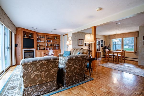 Dining room, Fireplace, Interior, Living room, Pendant Lights, Recessed Lighting, Wood Texture Flooring