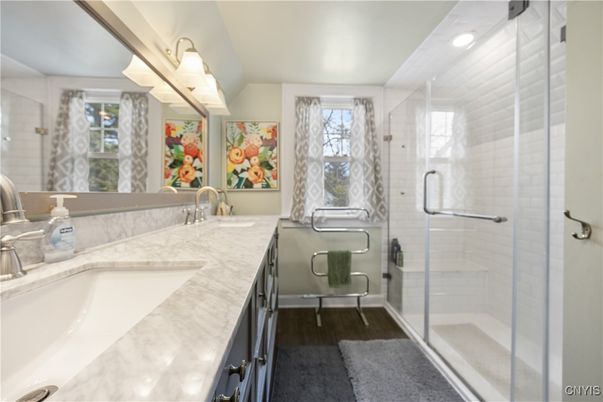 Bathroom, Dual Sink Vanities, Glass Shower, Interior, Recessed Lighting, Wood Texture Flooring