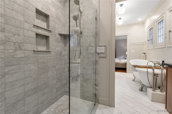 Bathroom, Free Standing Baths, Glass Shower, Interior, Marble Walls, Recessed Lighting, Stone Walls