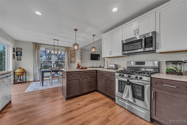 Dining room, Interior, Kitchen, Pendant Lights, Recessed Lighting, Stainless Steel Appliances, Wood Texture Flooring