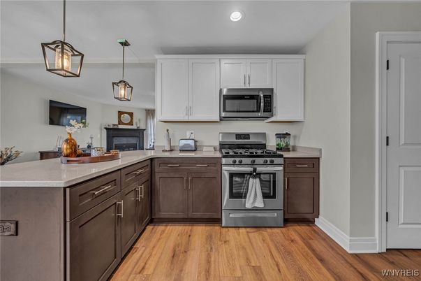 Fireplace, Interior, Kitchen, Pendant Lights, Recessed Lighting, Stainless Steel Appliances, Wood Texture Flooring