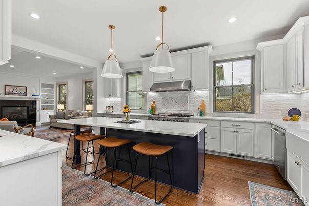 Fireplace, Interior, Kitchen, Living room, Pendant Lights, Recessed Lighting, Stainless Steel Appliances, Wood Texture Flooring