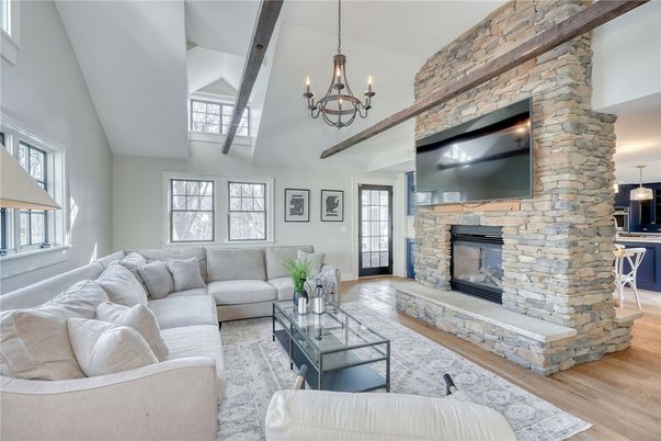 Chandelier, Fireplace, Interior, Living room, Stone Walls, Wooden Beams, Wood Texture Flooring
