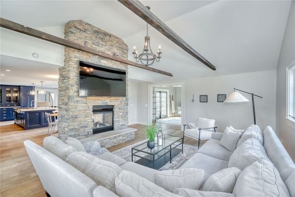 Chandelier, Fireplace, Interior, Kitchen, Living room, Pendant Lights, Recessed Lighting, Stone Walls, Wooden Beams, Wood Texture Flooring