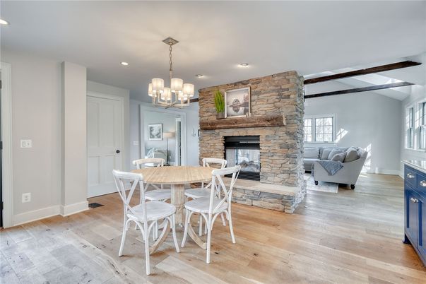 Chandelier, Dining room, Fireplace, Interior, Living room, Pendant Lights, Recessed Lighting, Stone Walls, Wood Texture Flooring