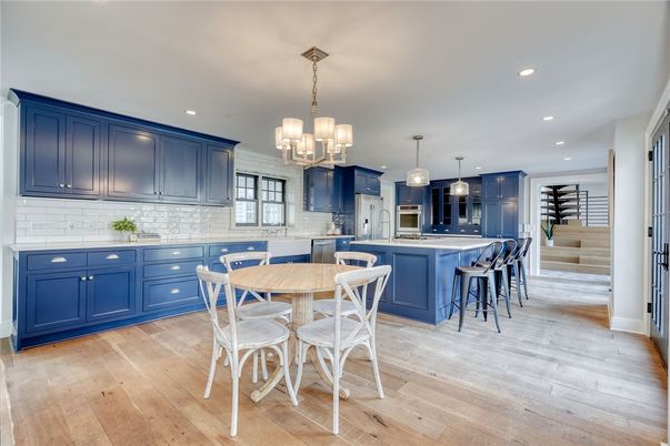 Chandelier, Dining room, Interior, Kitchen, Pendant Lights, Recessed Lighting, Stainless Steel Appliances, Wood Texture Flooring