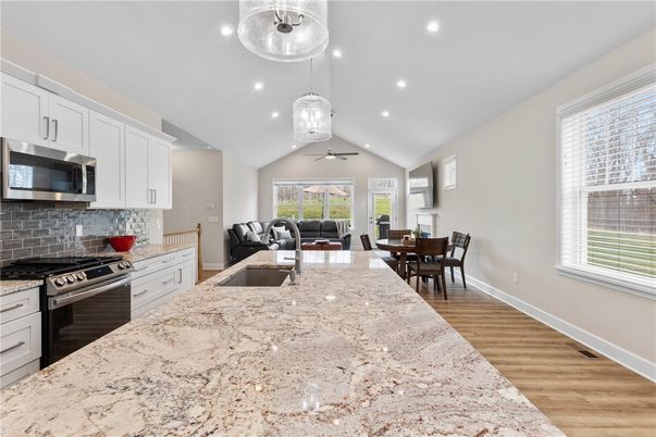 Dining room, Interior, Kitchen, Living room, Pendant Lights, Recessed Lighting, Stainless Steel Appliances, Wood Texture Flooring