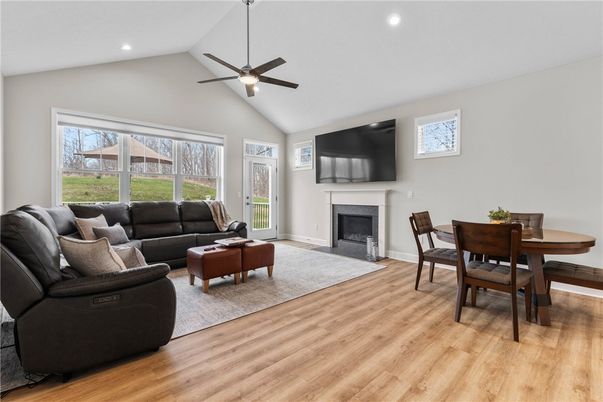 Dining room, Fireplace, Interior, Living room, Recessed Lighting, Wood Texture Flooring