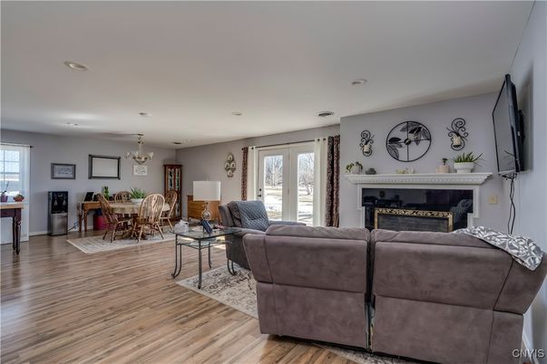 Chandelier, Dining room, Fireplace, Interior, Living room, Recessed Lighting, Wood Texture Flooring