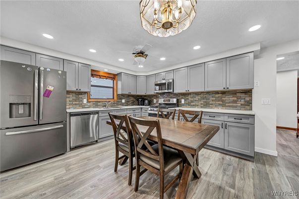 Dining room, Interior, Kitchen, Recessed Lighting, Stainless Steel Appliances, Wood Texture Flooring