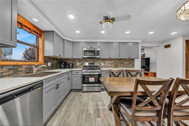 Dining room, Interior, Kitchen, Recessed Lighting, Stainless Steel Appliances, Wood Texture Flooring