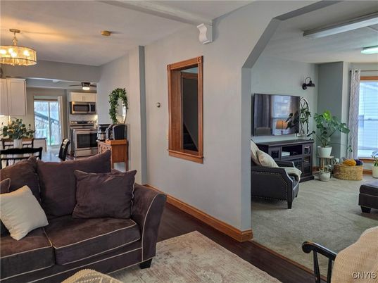 Chandelier, Dining room, Interior, Kitchen, Living room, Stainless Steel Appliances, Wood Texture Flooring